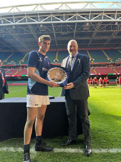 Iestyn Comey receives the coveted trophy